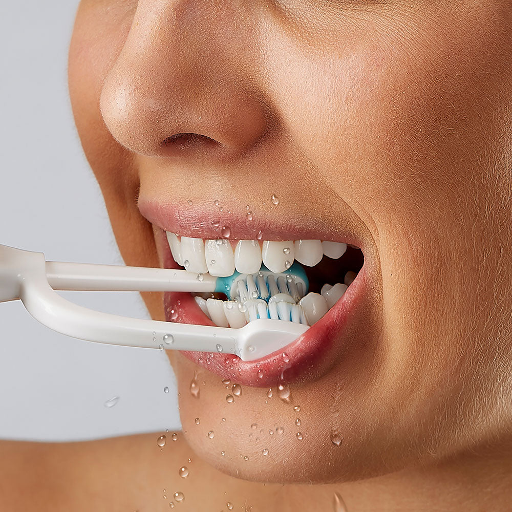 Brush your teeth and water floss, both sides of your teeth with ToothShower water flossing dual headed toothbrush. 