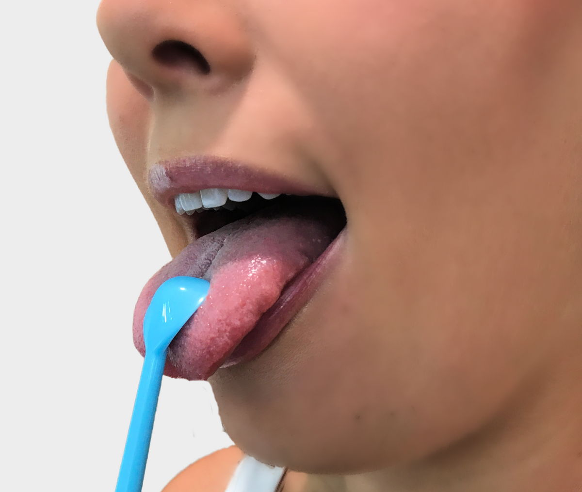 blue irrigating scraping of the tongue 